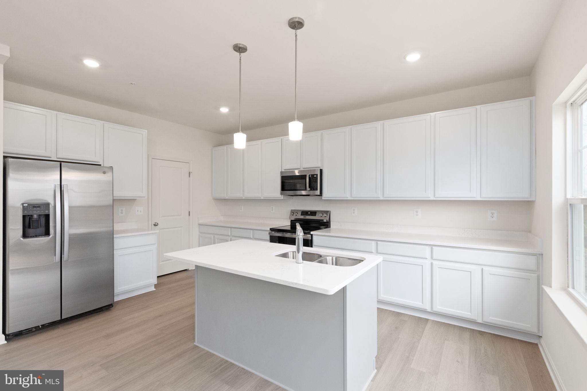111 Nell Street Perryville, MD 21903 - Photo 18 of 29 a kitchen with a sink stainless steel appliances and cabinets