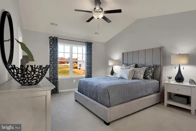 a bedroom with bed and window