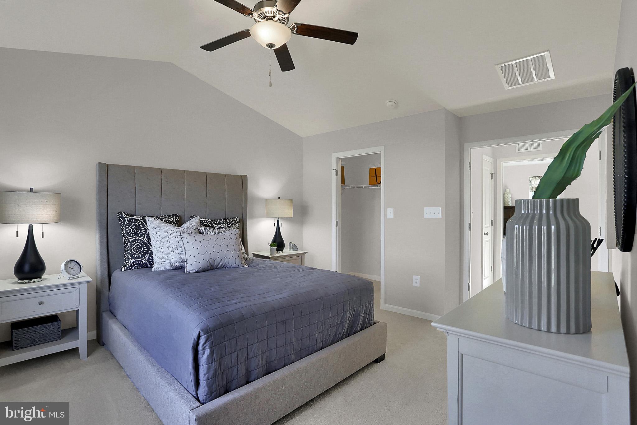 111 Nell Street Perryville, MD 21903 - Photo 19 of 22 a bedroom with a bed and a chandelier