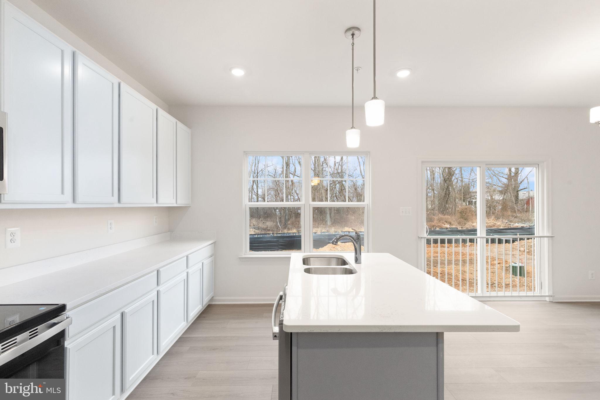 111 Nell Street Perryville, MD 21903 - Photo 19 of 29 a kitchen with counter top space and windows
