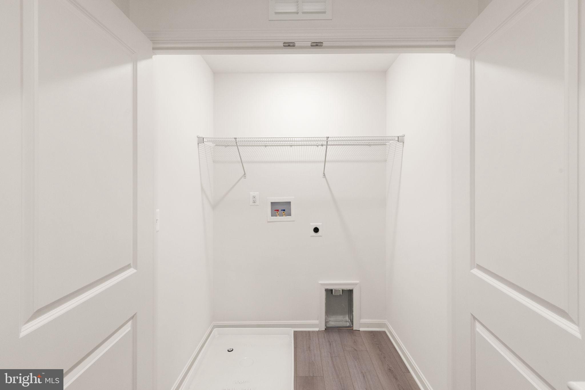 111 Nell Street Perryville, MD 21903 - Photo 20 of 29 a view of walk in closet with wooden floor