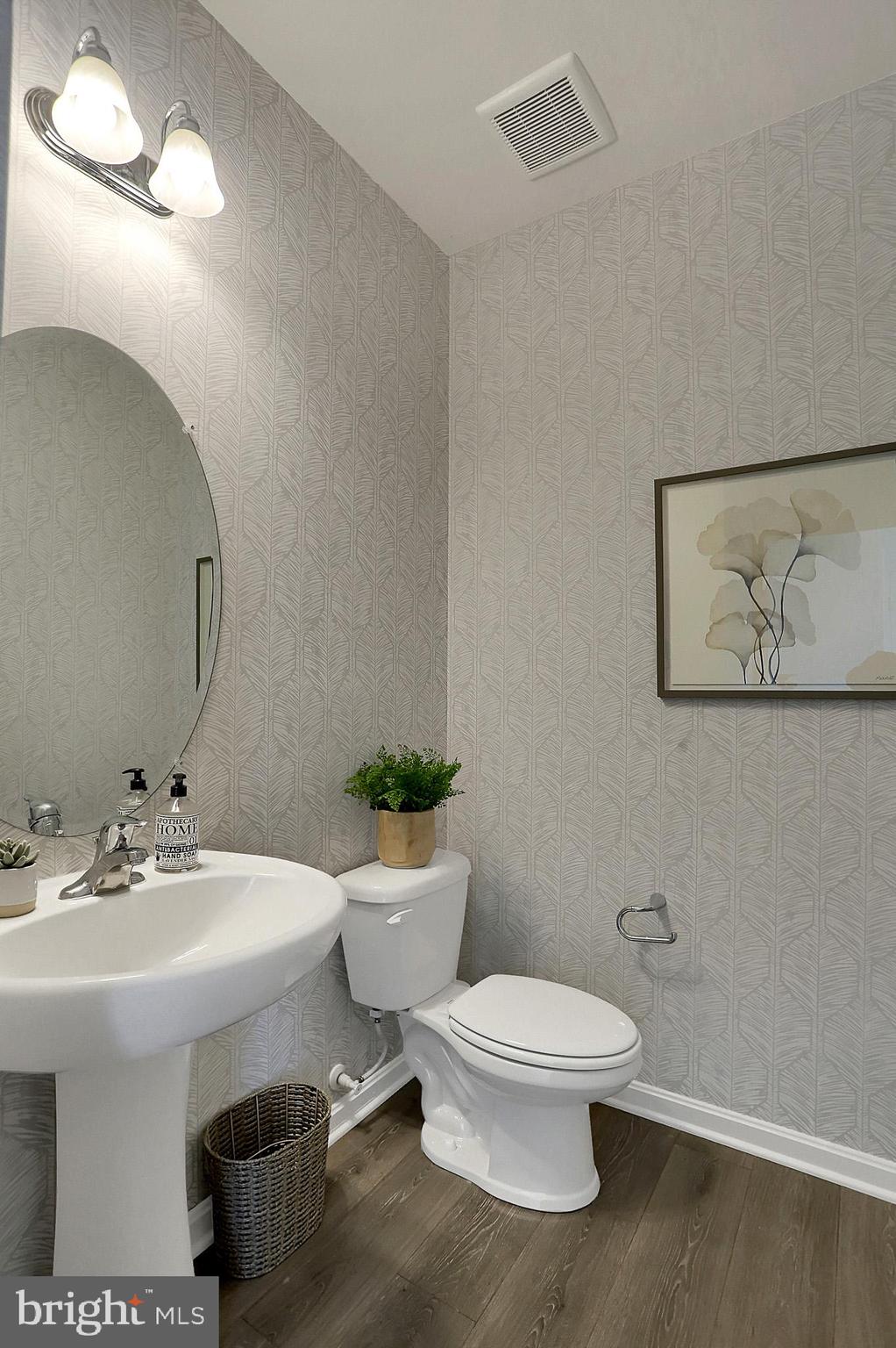 111 Nell Street Perryville, MD 21903 - Photo 21 of 22 a white toilet sitting next to a bathroom sink