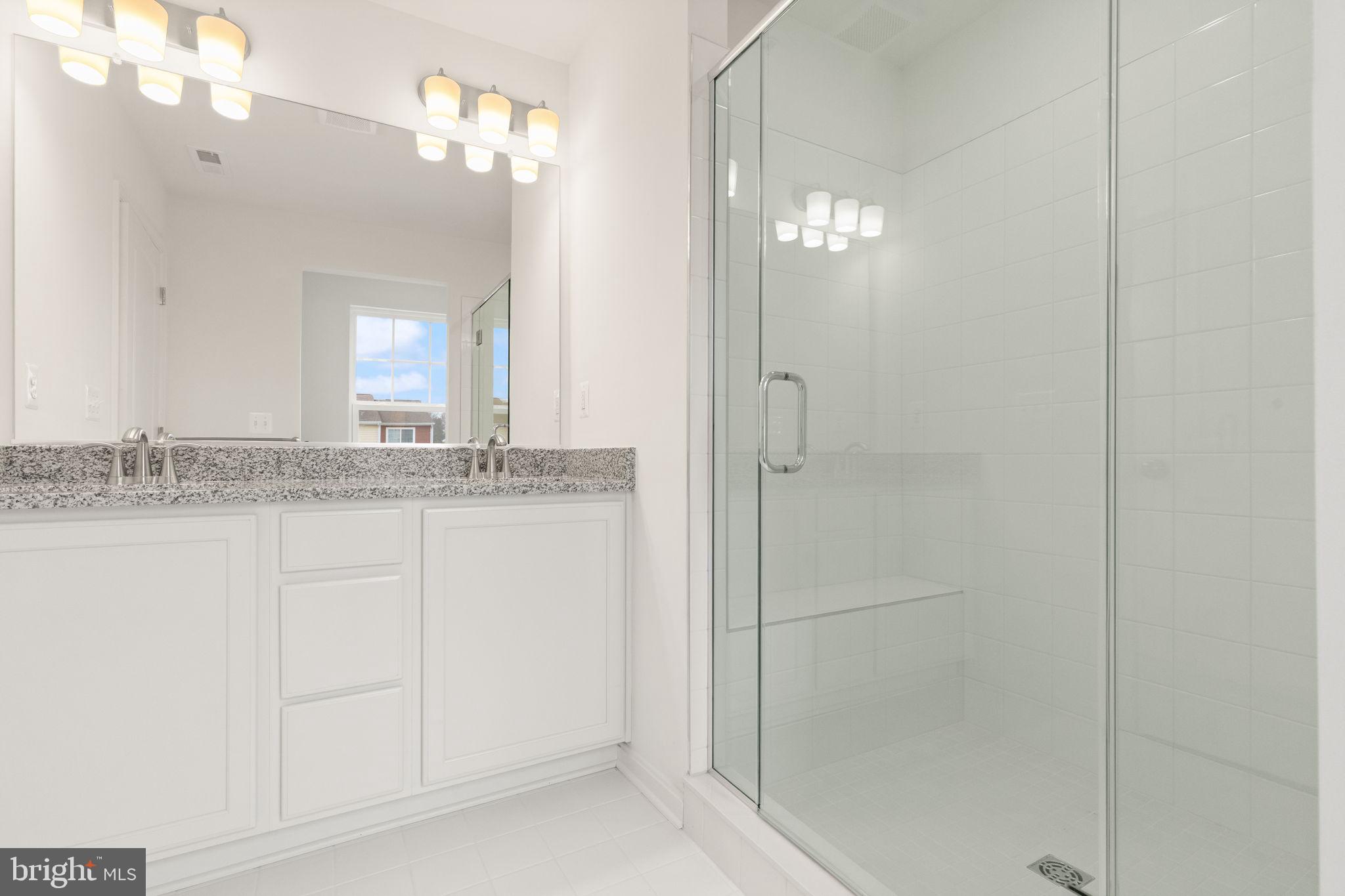 111 Nell Street Perryville, MD 21903 - Photo 23 of 29 a bathroom with a granite countertop sink and a mirror
