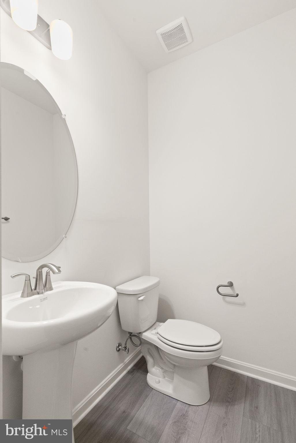 111 Nell Street Perryville, MD 21903 - Photo 5 of 29 a white toilet sitting next to a bathroom sink