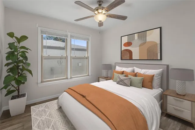 a bedroom with bed and a window