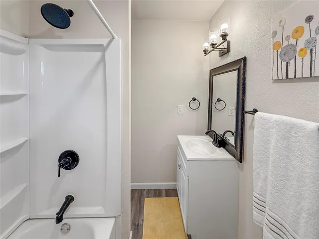 a bathroom with a sink and mirror