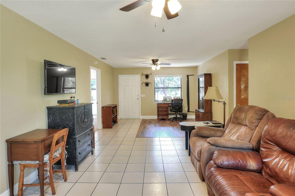 4846 Knights Station Road Lakeland, FL 33810 - Photo 13 of 49 a living room with furniture and a flat screen tv