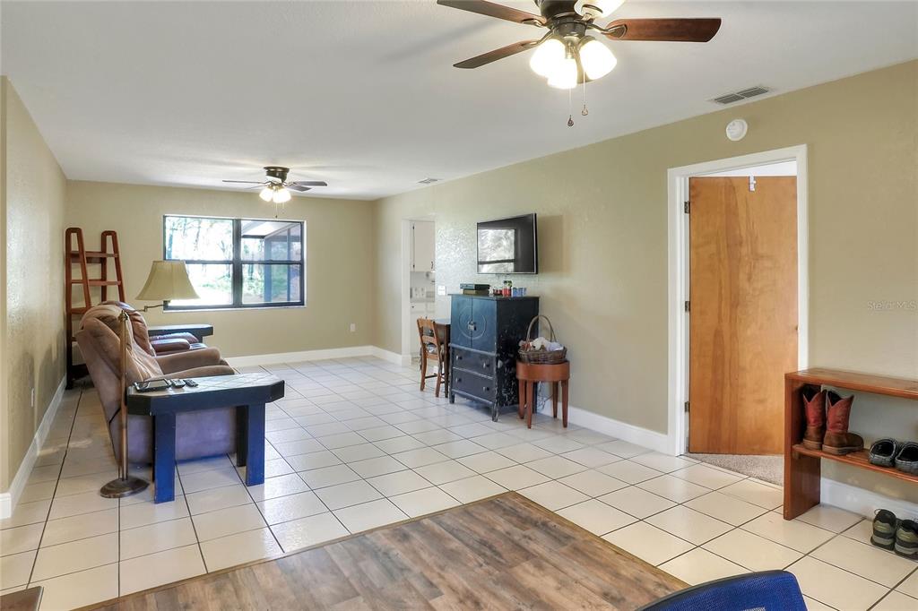 4846 Knights Station Road Lakeland, FL 33810 - Photo 16 of 49 a view of a workspace with furniture and a window
