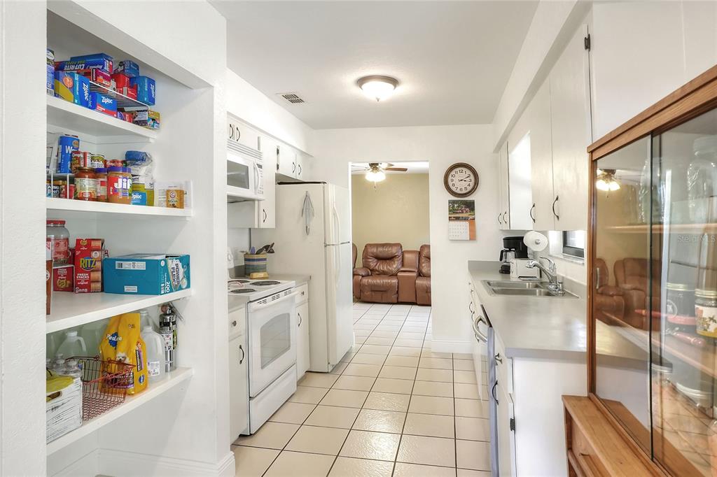 4846 Knights Station Road Lakeland, FL 33810 - Photo 17 of 49 a kitchen with stainless steel appliances a refrigerator and a sink