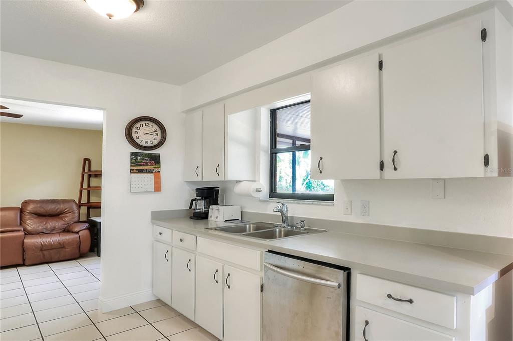 4846 Knights Station Road Lakeland, FL 33810 - Photo 18 of 49 a kitchen with a sink cabinets and window