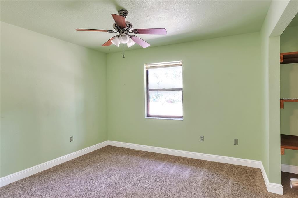 4846 Knights Station Road Lakeland, FL 33810 - Photo 27 of 49 an empty room with a window and a fan