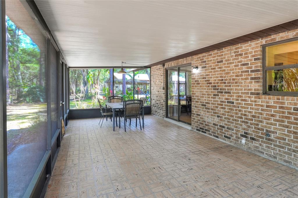 4846 Knights Station Road Lakeland, FL 33810 - Photo 28 of 49 a dining room with furniture and a floor to ceiling window