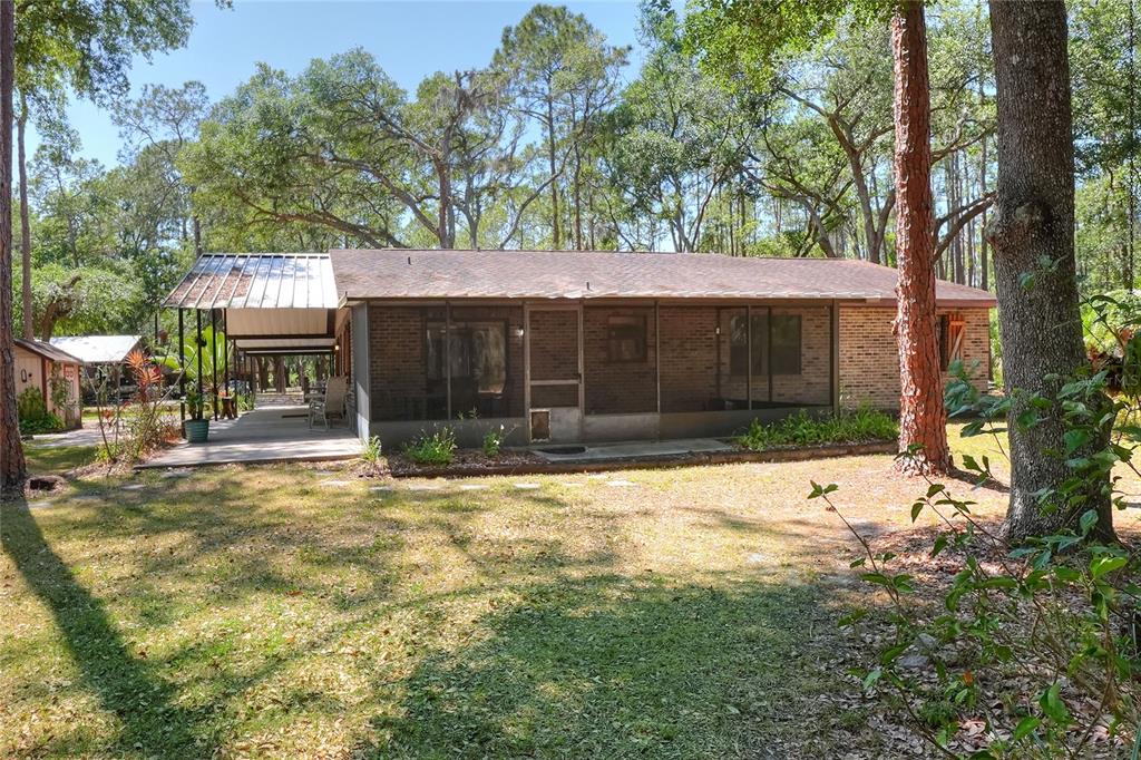 4846 Knights Station Road Lakeland, FL 33810 - Photo 30 of 49 a front view of a house with a yard and garage