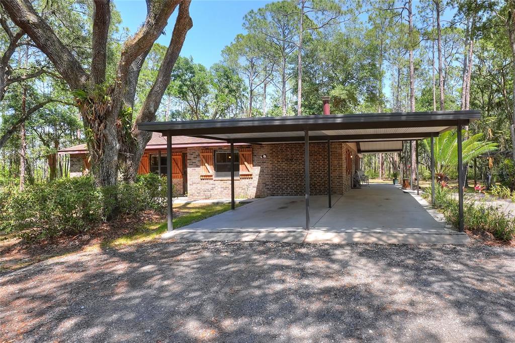 4846 Knights Station Road Lakeland, FL 33810 - Photo 34 of 49 a view of a backyard with a large tree
