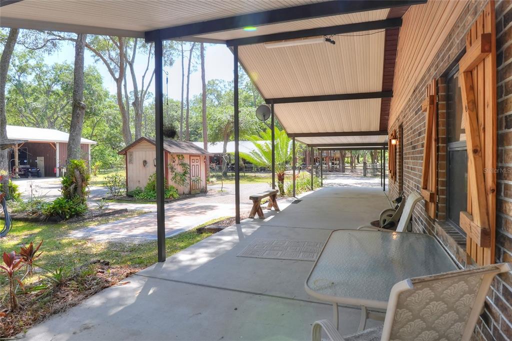 4846 Knights Station Road Lakeland, FL 33810 - Photo 35 of 49 a living room with hardwood floor and a floor to ceiling window