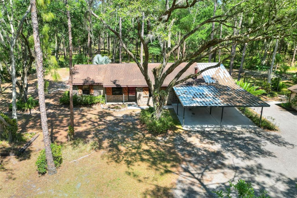4846 Knights Station Road Lakeland, FL 33810 - Photo 6 of 49 a view of a house with a tree in the background