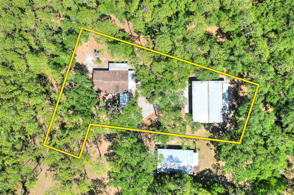 4846 Knights Station Road Lakeland, FL 33810 - Photo 8 of 49 a view of a house with a tree and a street sign