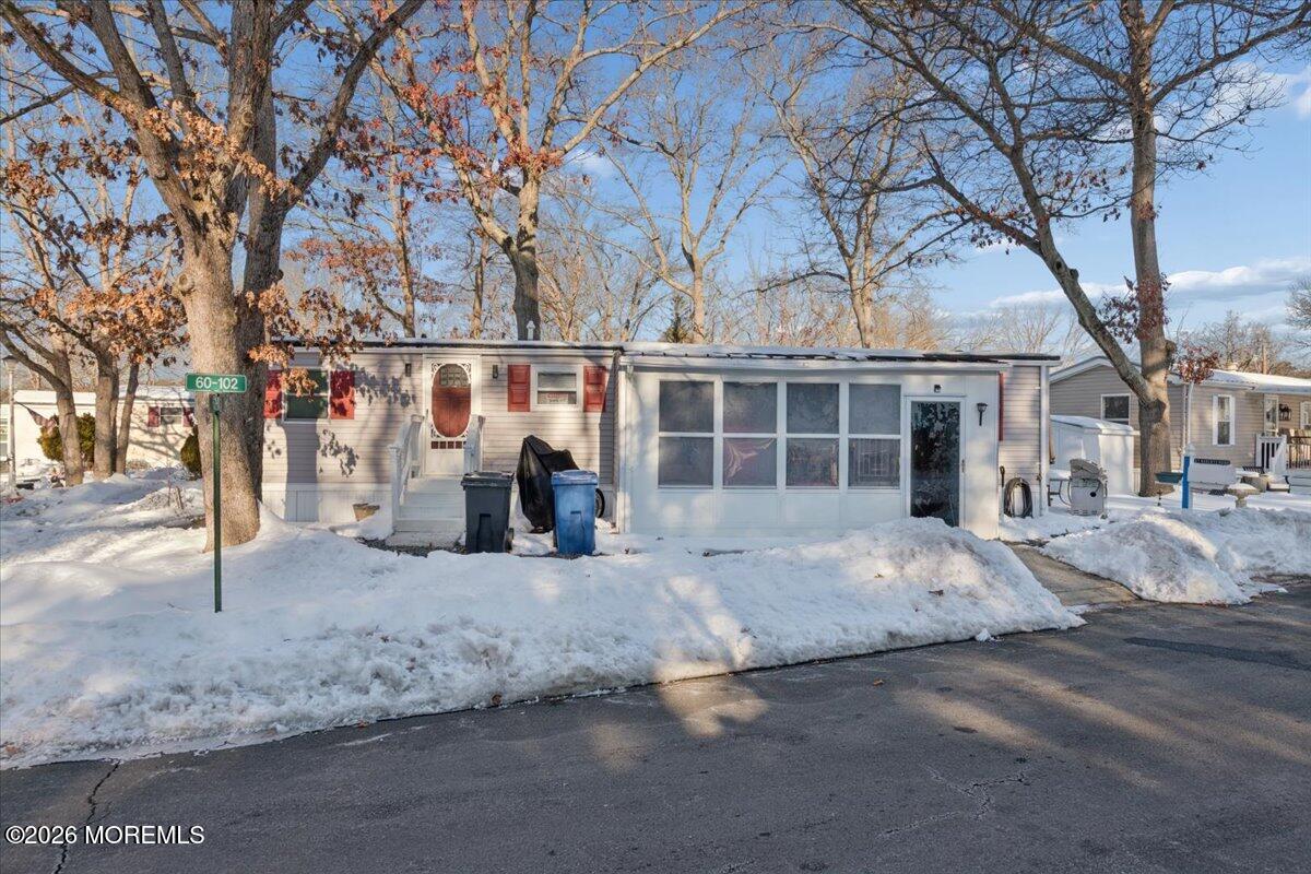 57 Roberts Road Toms River, NJ 08755 - Photo 6 of 14 a view of a house with a snow in the road
