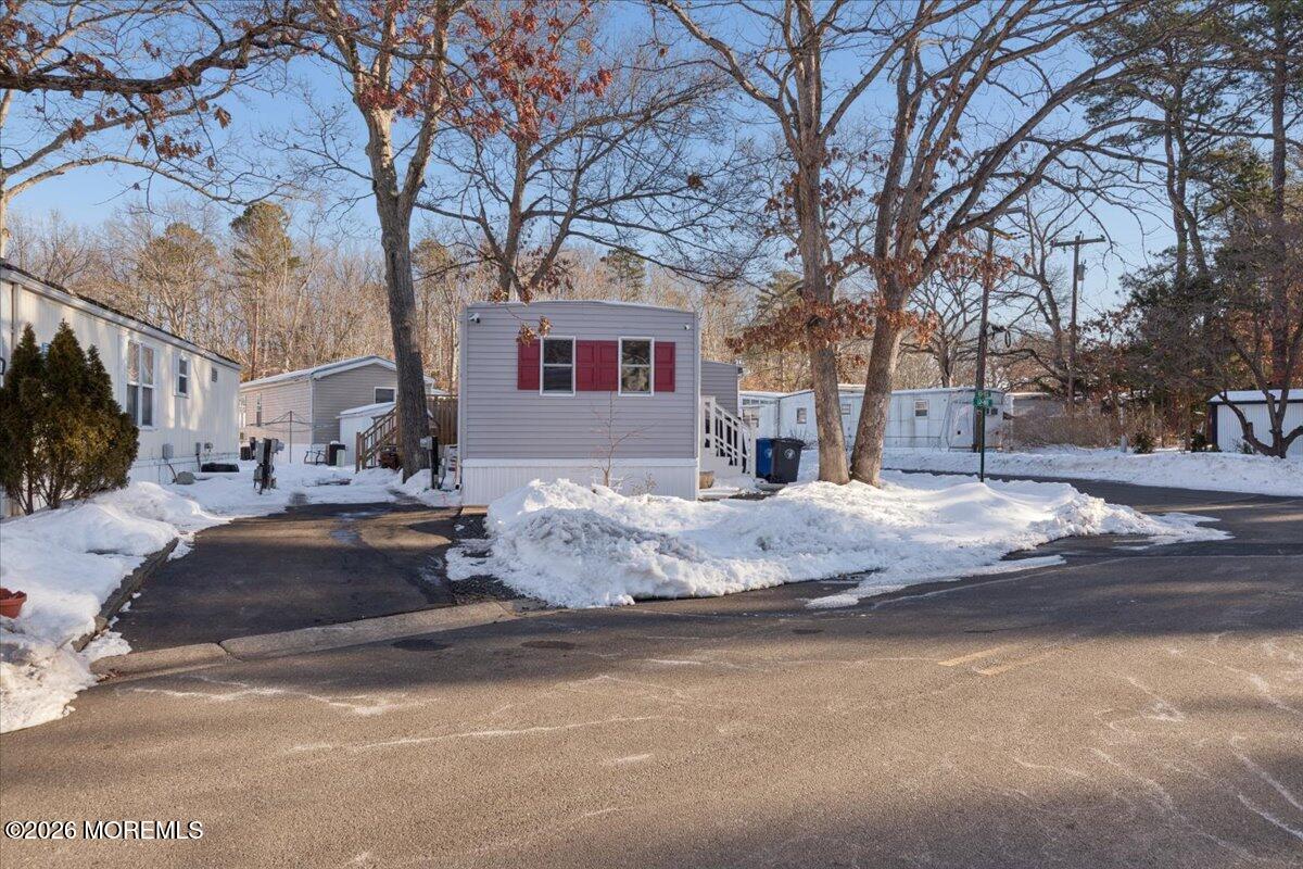 57 Roberts Road Toms River, NJ 08755 - Photo 7 of 14 a front view of a house with a snow on the road
