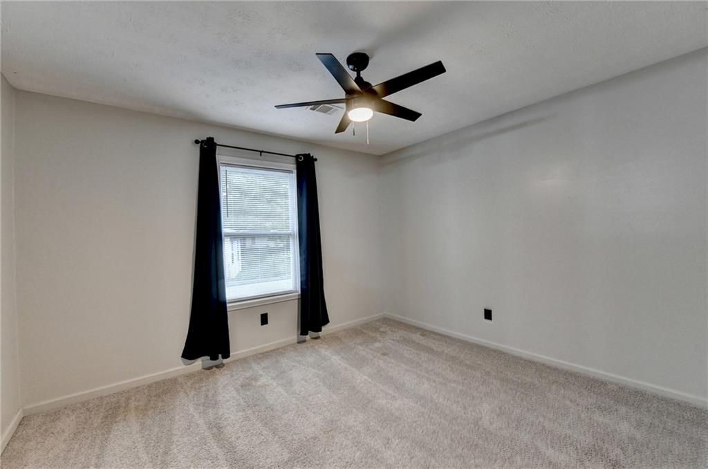 801 Davis Street Monroe, GA 30655 - Photo 23 of 33 a view of an empty room with a window