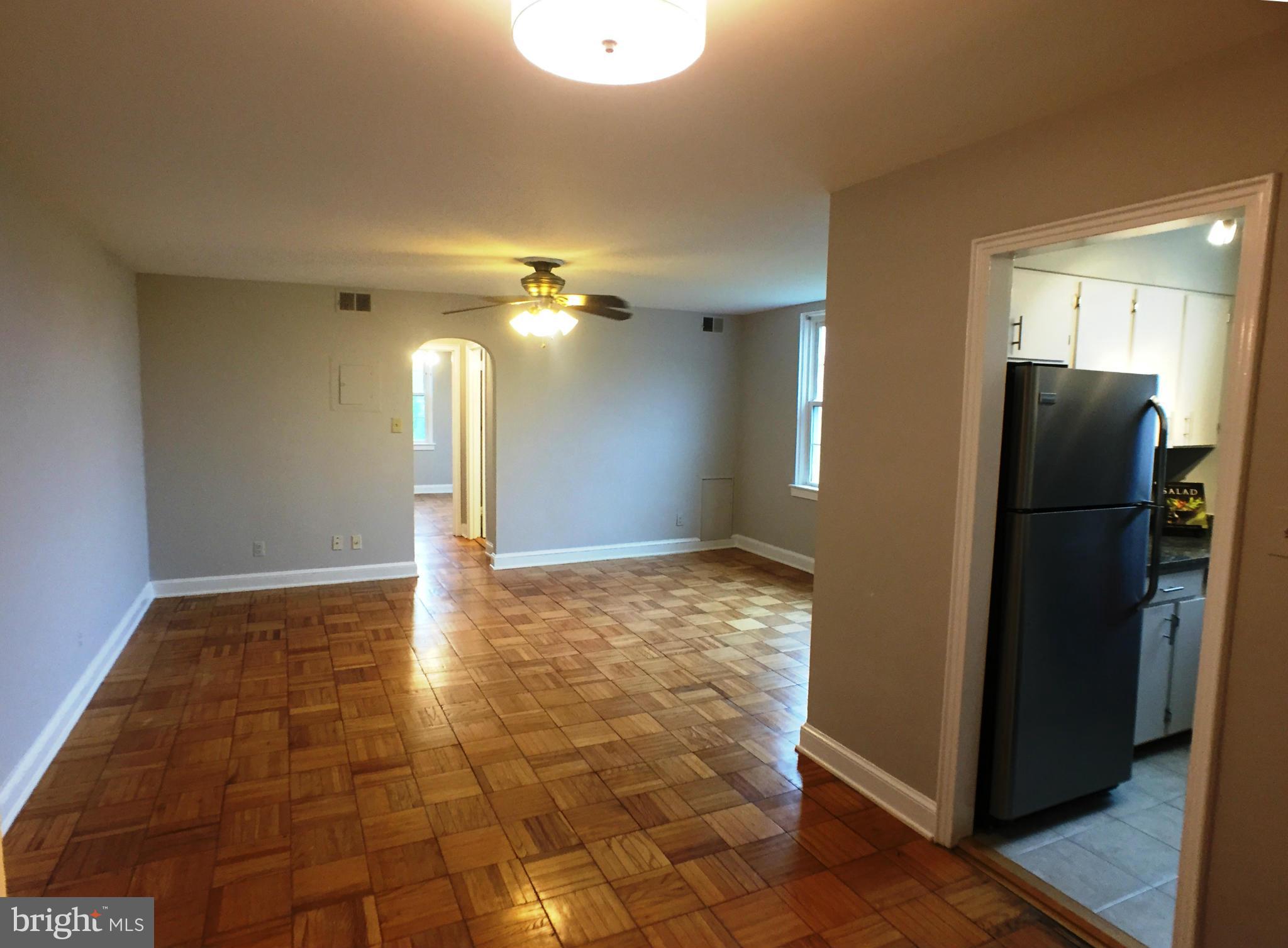 30 South Old Glebe Road, Unit 302E Arlington, VA 22204 - Photo 3 of 21 a view of a refrigerator in kitchen and an empty room