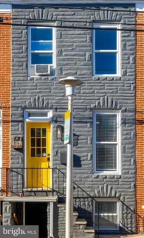 a front view of a house with glass windows