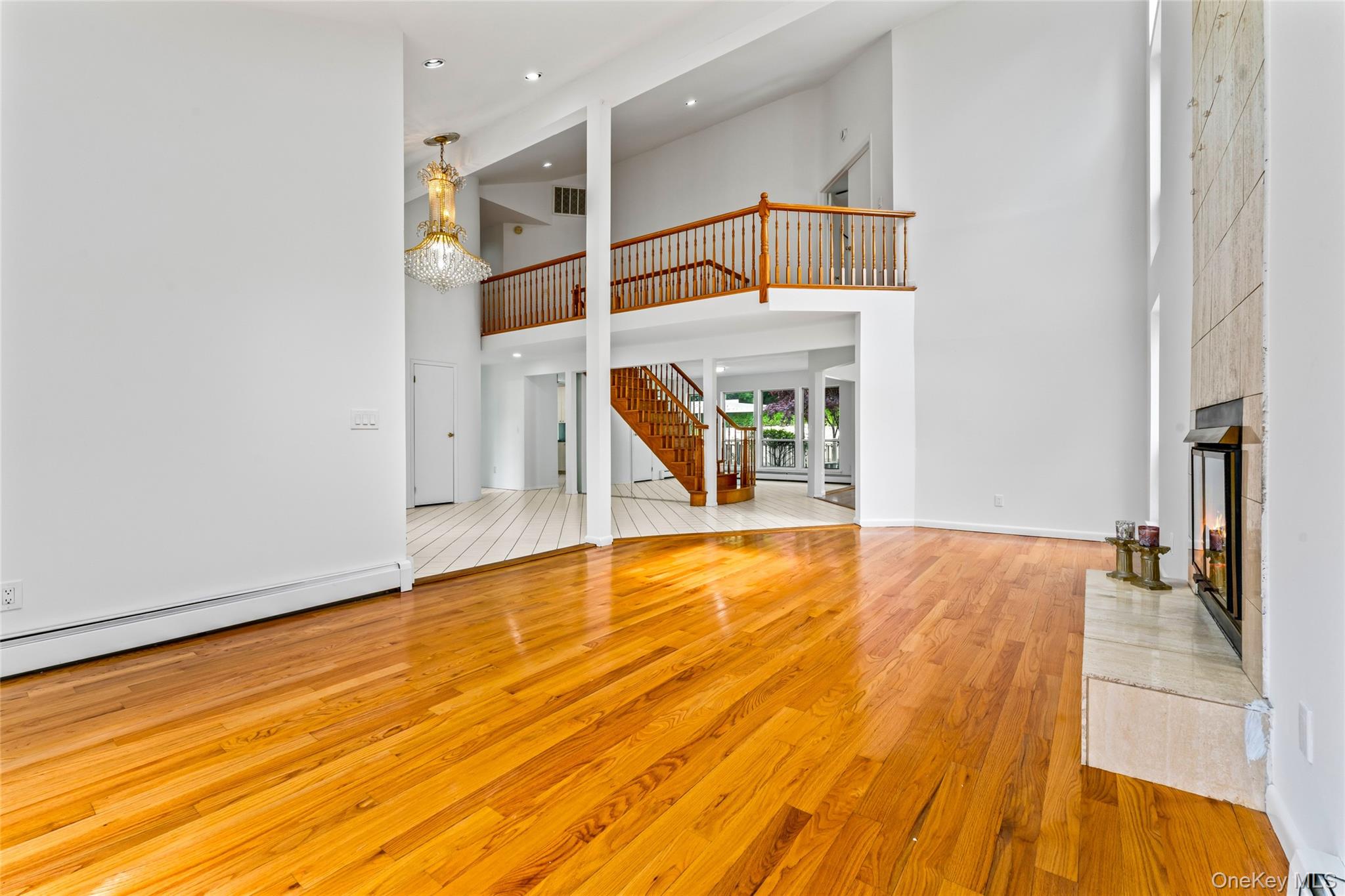 126 Bagatelle Road Melville, NY 11747 - Photo 12 of 50 a view of empty room with wooden floor