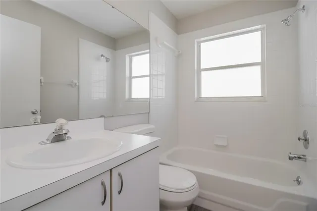 a bathroom with a sink toilet and bathtub