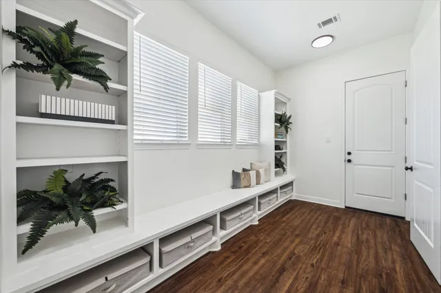 a view of entryway with wooden floor
