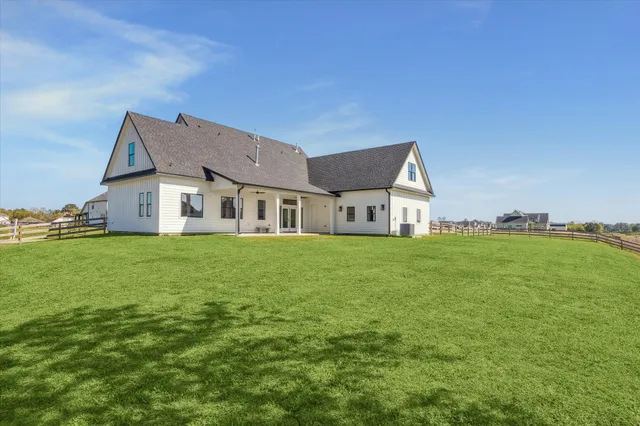 a view of a house with a big yard
