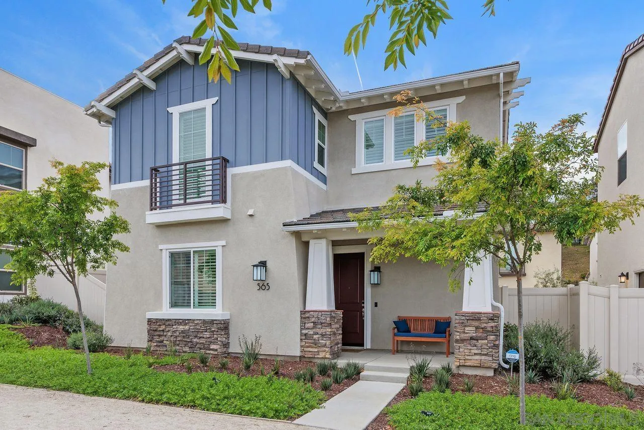 565 Townsend Way San Marcos, CA 92078 - Photo 1 of 33 a front view of a house with a yard and garage