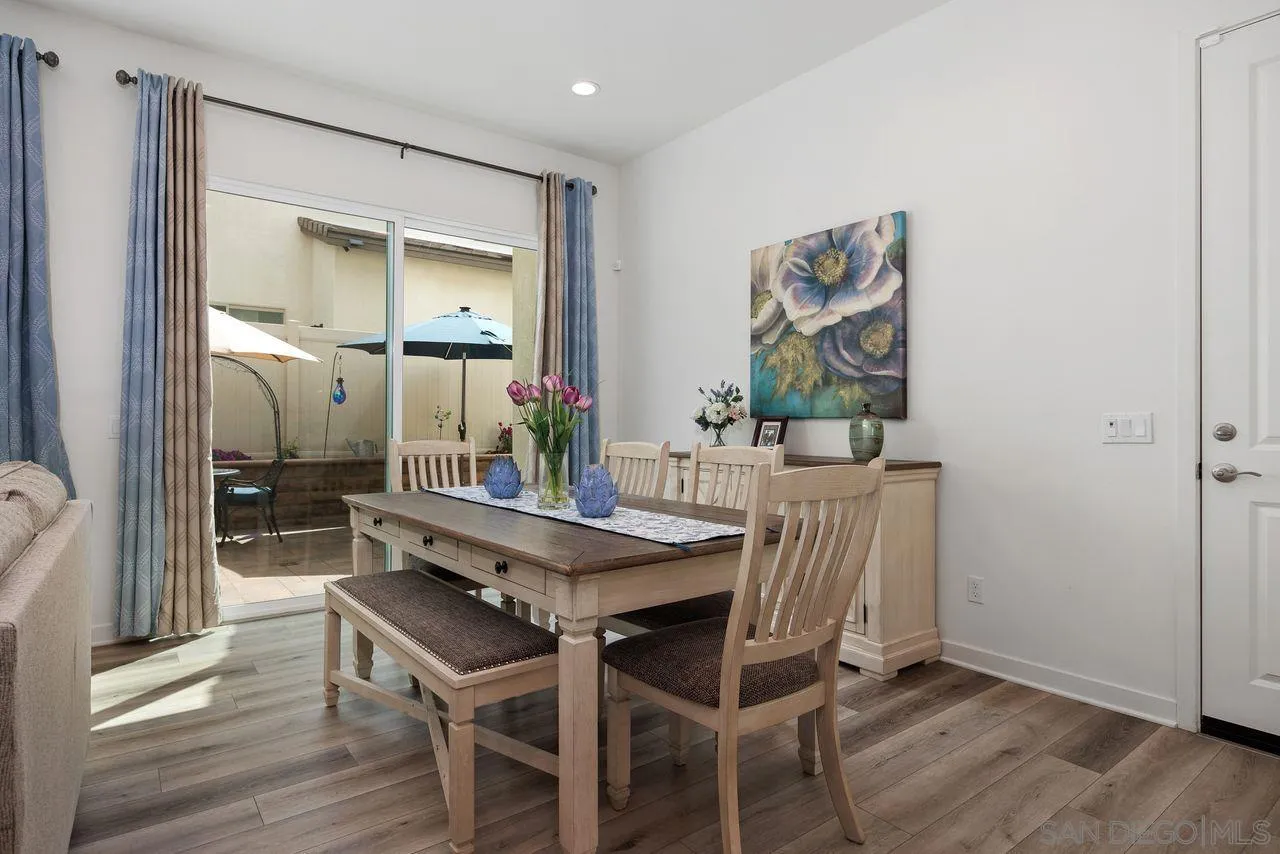 565 Townsend Way San Marcos, CA 92078 - Photo 11 of 33 a dining room with furniture and wooden floor