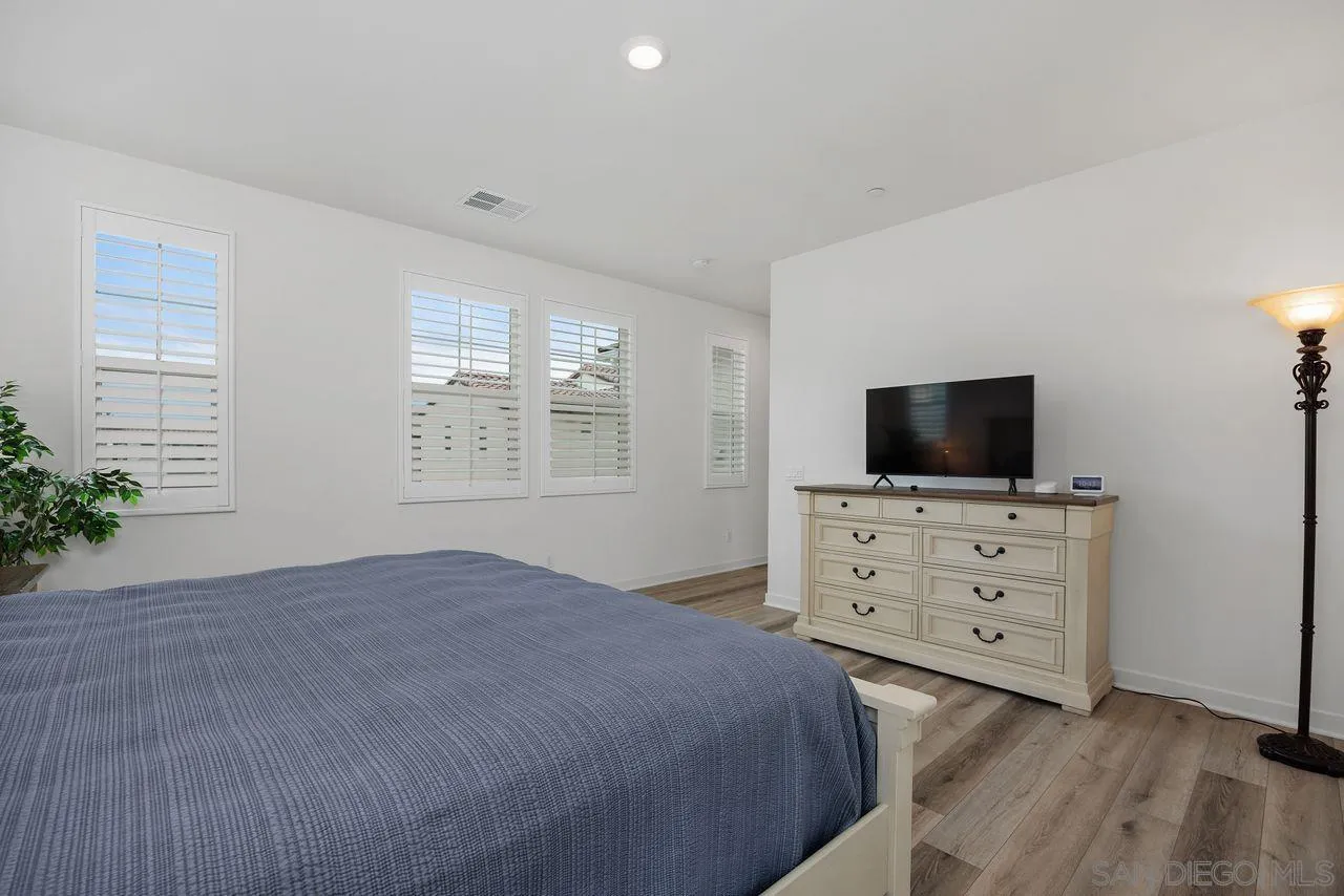 565 Townsend Way San Marcos, CA 92078 - Photo 14 of 33 a bedroom with a bed and flat screen tv