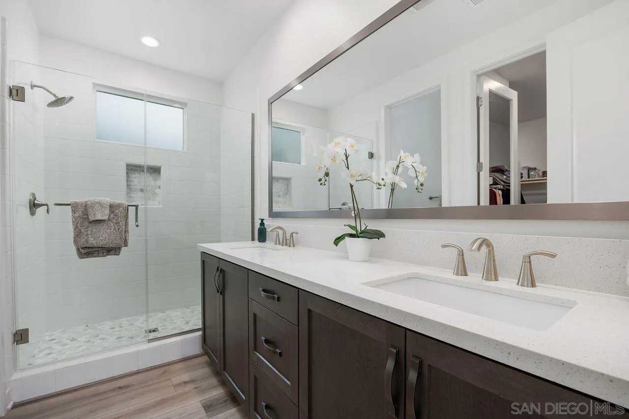 565 Townsend Way San Marcos, CA 92078 - Photo 15 of 33 a bathroom with a double vanity sink mirror and shower