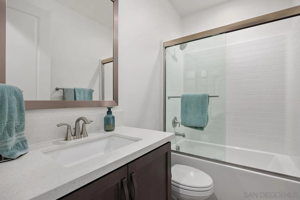 565 Townsend Way San Marcos, CA 92078 - Photo 18 of 33 a bathroom with a sink toilet and shower