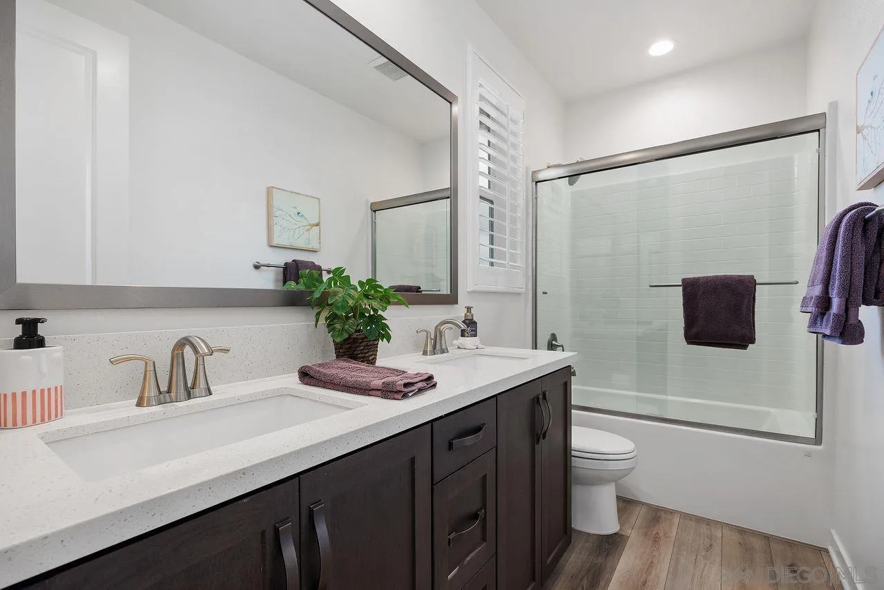 565 Townsend Way San Marcos, CA 92078 - Photo 20 of 33 a bathroom with a sink a toilet and shower