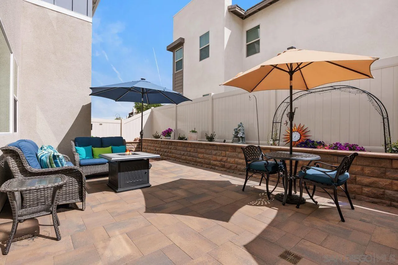 565 Townsend Way San Marcos, CA 92078 - Photo 24 of 33 a view of a tables and chairs under an umbrella in patio