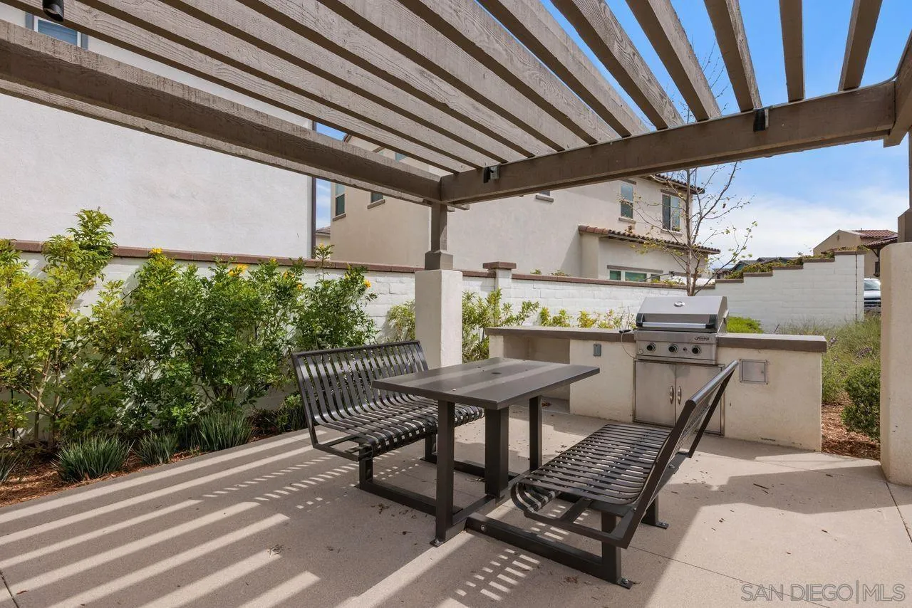 565 Townsend Way San Marcos, CA 92078 - Photo 28 of 33 a roof deck with table and chairs and potted plants