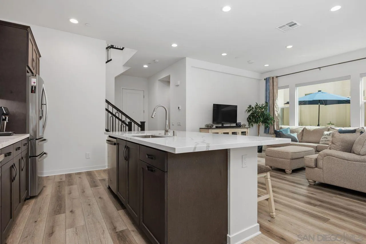 565 Townsend Way San Marcos, CA 92078 - Photo 10 of 33 a kitchen with sink refrigerator and microwave