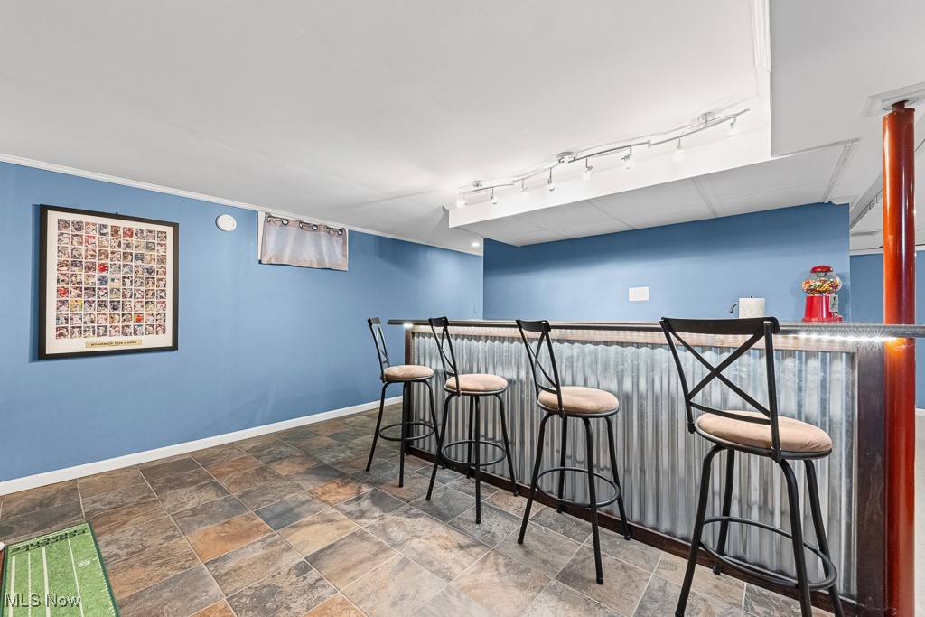 4000 Kenneth Road Stow, OH 44224 - Photo 35 of 50 Indoor dry bar with baseboards and stone finish floors