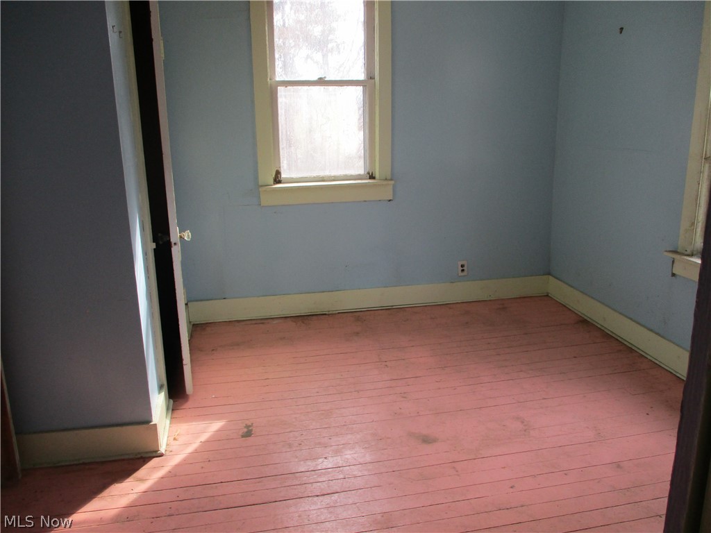14831 Calaboone Road Doylestown, OH 44230 - Photo 10 of 14 Unfurnished room with light wood-type flooring and baseboards