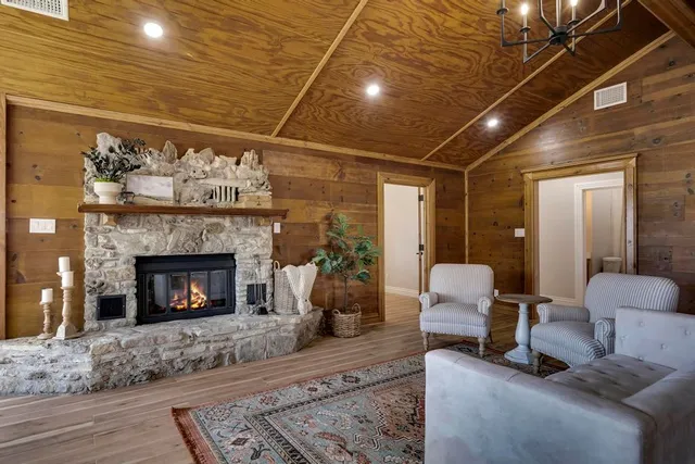 a view of a patio with table and chairs and wooden floor
