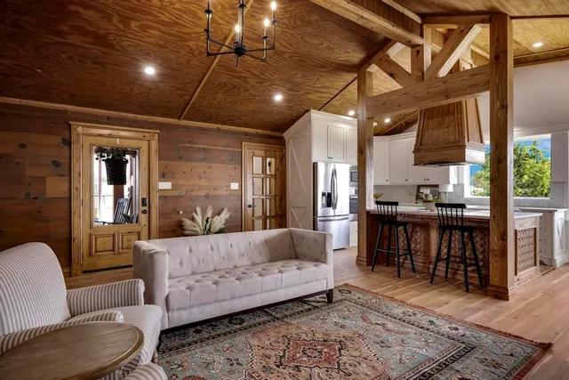 a kitchen with a cabinets and chandelier