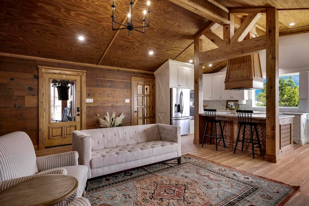 111 Stoney Hills Road Center Point, TX 78010 - Photo 18 of 61 a living room with furniture a ceiling fan and a rug