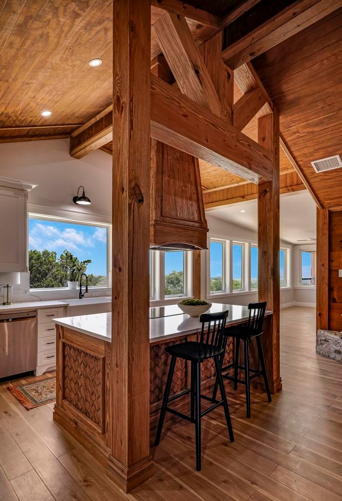 111 Stoney Hills Road Center Point, TX 78010 - Photo 22 of 61 a view of a patio with table and chairs and wooden floor