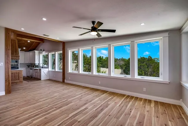 a bathroom with a sink vanity mirror and toilet