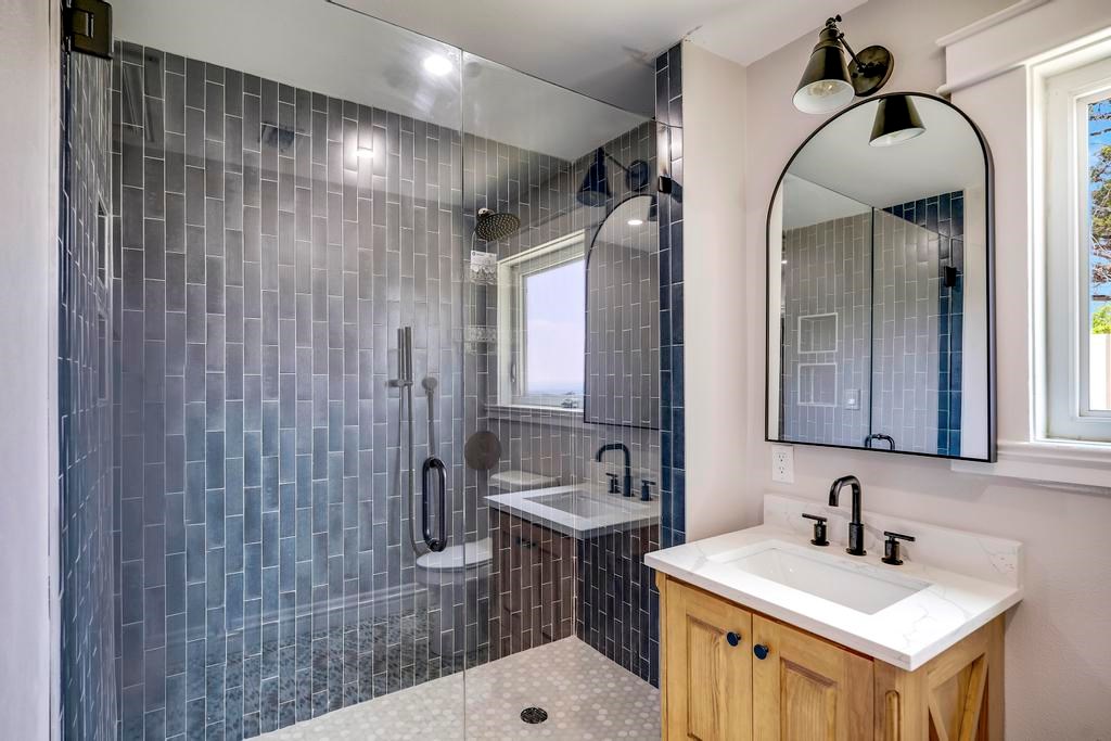 111 Stoney Hills Road Center Point, TX 78010 - Photo 36 of 61 a bathroom with a sink mirror vanity and toilet