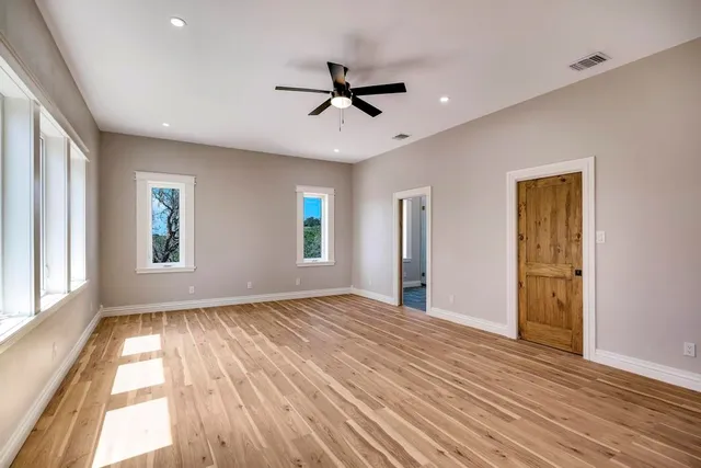 a view of an empty room with a large window
