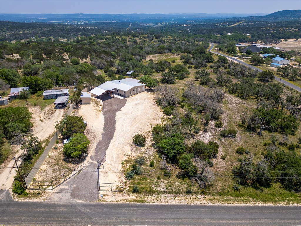 111 Stoney Hills Road Center Point, TX 78010 - Photo 10 of 61 an aerial view of residential houses with outdoor space and trees