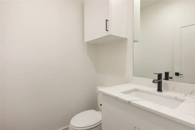 a bathroom with a sink and toilet